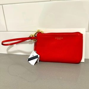 Coach red leather wristlet.